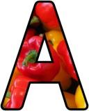 Printable Classroom Display Lettering with a Red and Yellow Peppers background.  Fruit and Veg alphabet sets.