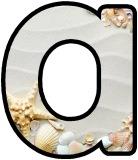 Free printable digital lettering sets for classroom bulletin board display.  Seashells on sand background letters and numbers.